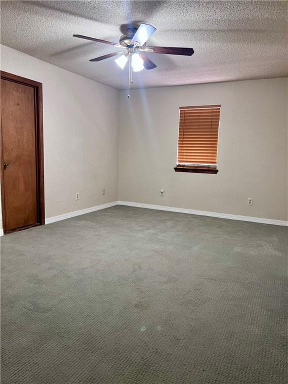 806 Dakota St, Robstown, TX 78380 - carpeted spare room with a ceiling fan and a textured ceiling