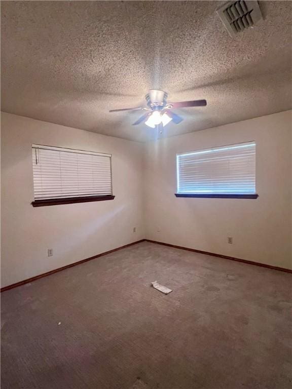 806 Dakota St, Robstown, TX 78380 - unfurnished room featuring ceiling fan, carpet floors, and a textured ceiling