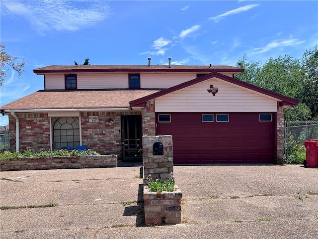 806 Dakota St, Robstown, TX 78380 - view of front facade featuring an attached garage, concrete driveway, roof with shingles, and brick siding