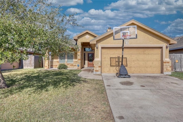 view of front of property featuring a garage and a front yard