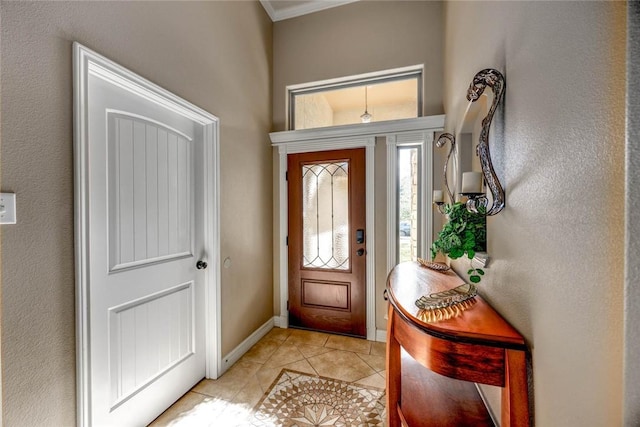 entryway with light tile patterned flooring