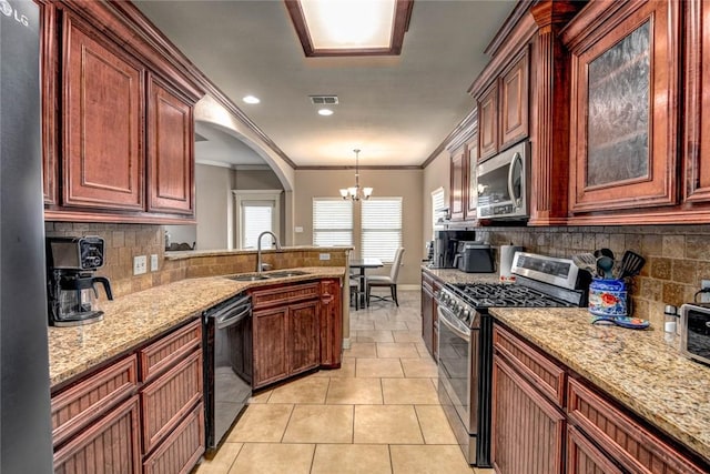 kitchen with decorative light fixtures, sink, an inviting chandelier, stainless steel appliances, and light tile patterned floors