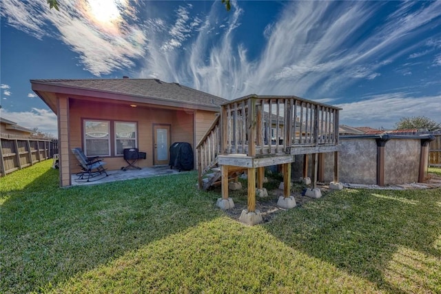 rear view of house with a lawn