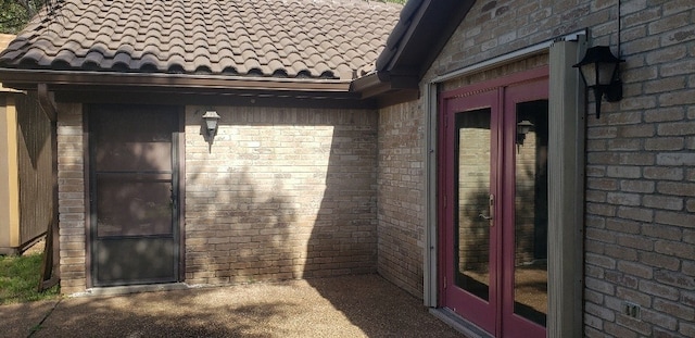 property entrance featuring french doors