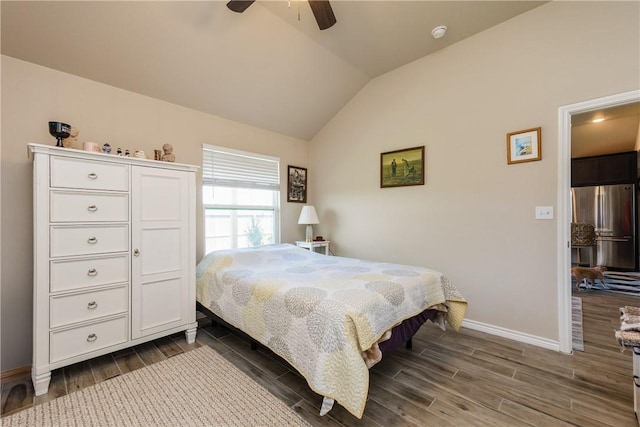 6766 Mikayla St, Corpus Christi, TX 78413 - bedroom featuring freestanding refrigerator, dark wood finished floors, lofted ceiling, baseboards, and ceiling fan