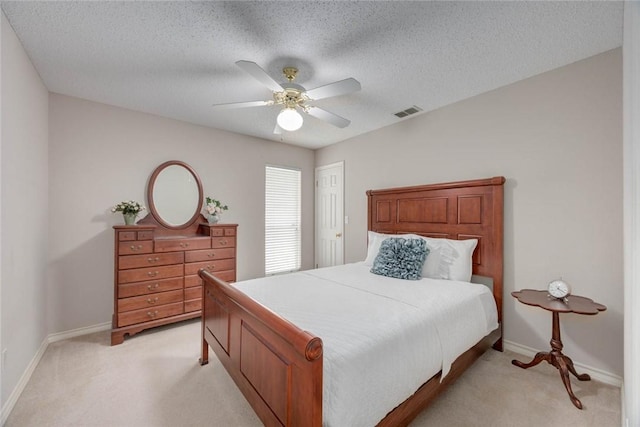 8006 Etienne Dr, Corpus Christi, TX 78414 - bedroom with light carpet, baseboards, ceiling fan, and a textured ceiling