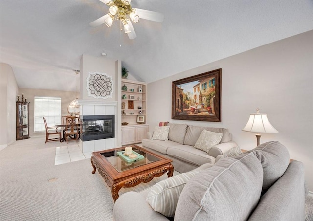 8006 Etienne Dr, Corpus Christi, TX 78414 - carpeted living room with lofted ceiling, a ceiling fan, baseboards, and a tile fireplace