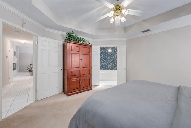 8006 Etienne Dr, Corpus Christi, TX 78414 - bedroom featuring light colored carpet, a tray ceiling, light tile patterned floors, ceiling fan, and ornamental molding