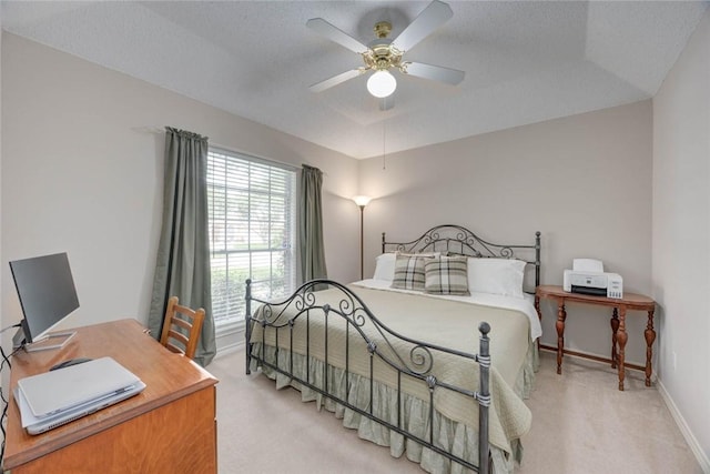 8006 Etienne Dr, Corpus Christi, TX 78414 - bedroom featuring light colored carpet, baseboards, a desk, and a ceiling fan