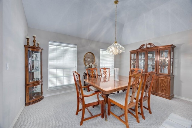 8006 Etienne Dr, Corpus Christi, TX 78414 - dining area featuring a chandelier, light carpet, lofted ceiling, and baseboards