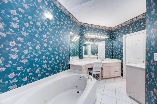 8006 Etienne Dr, Corpus Christi, TX 78414 - bathroom with vanity, a tub with jets, tile patterned floors, wallpapered walls, and a textured ceiling