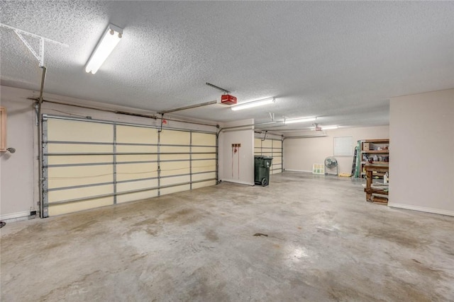 8006 Etienne Dr, Corpus Christi, TX 78414 - garage with a garage door opener and baseboards