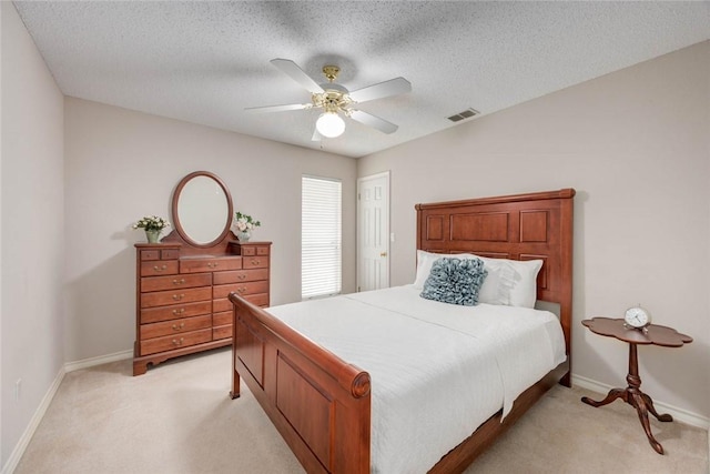 8006 Etienne Dr, Corpus Christi, TX 78414 - bedroom featuring light carpet, baseboards, a ceiling fan, and a textured ceiling