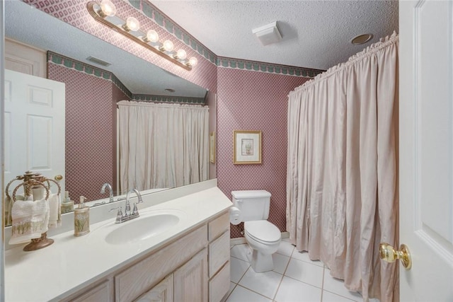 8006 Etienne Dr, Corpus Christi, TX 78414 - bathroom with a textured ceiling, wallpapered walls, vanity, toilet, and tile patterned flooring