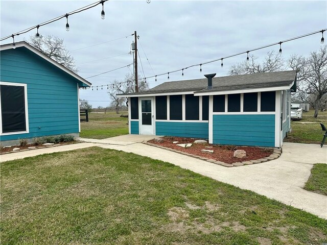 view of yard featuring a sunroom