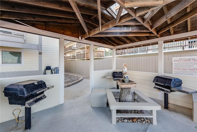 view of patio / terrace with area for grilling, fence, and a gazebo