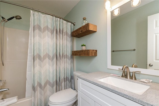 full bath with toilet, vanity, and shower / bath combo