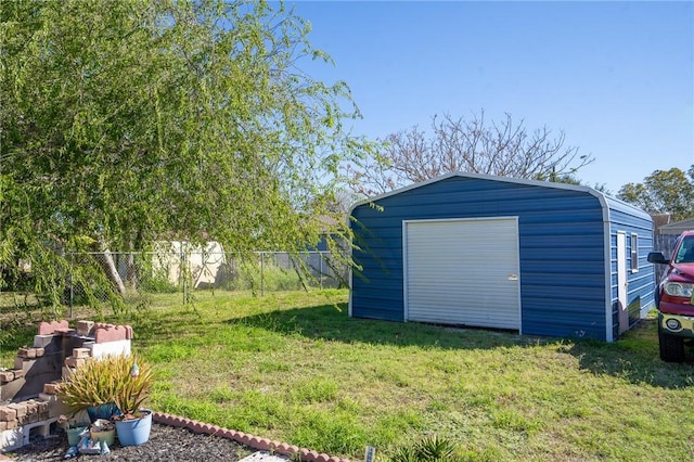 garage featuring a lawn