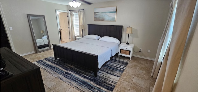 tiled bedroom featuring ceiling fan