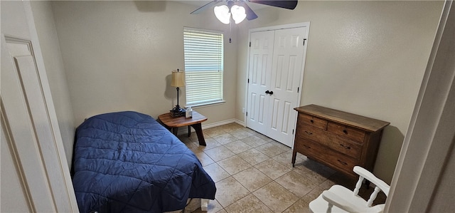 tiled bedroom with ceiling fan