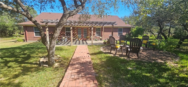 back of property featuring a patio area and a yard