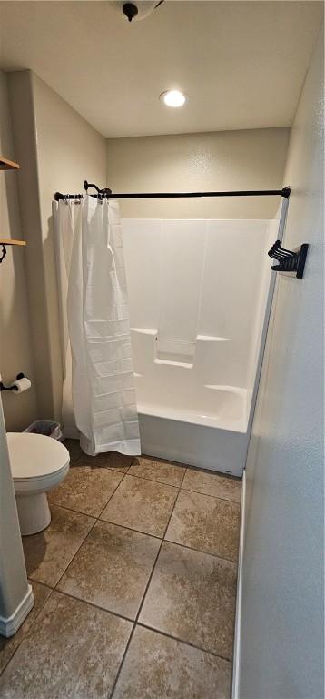 clothes washing area featuring washer / clothes dryer and tile patterned flooring