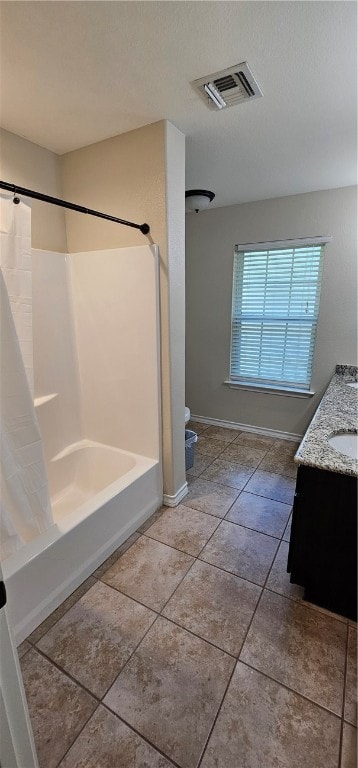 bathroom with tile patterned flooring, vanity, and shower / bathtub combination with curtain