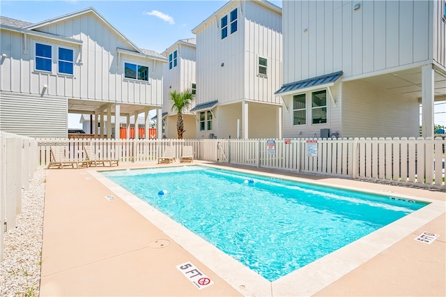 view of swimming pool with a patio area