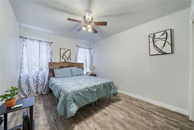 bedroom featuring hardwood / wood-style flooring and ceiling fan