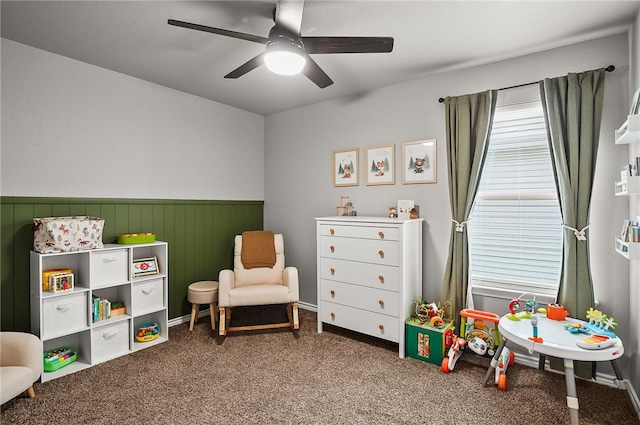 2689 Everly Ln, Corpus Christi, TX 78415 - game room featuring ceiling fan, a wainscoted wall, and carpet flooring
