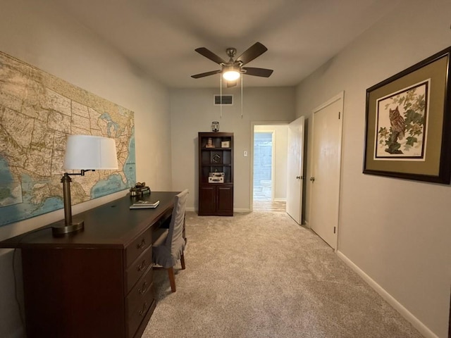 hallway featuring light colored carpet