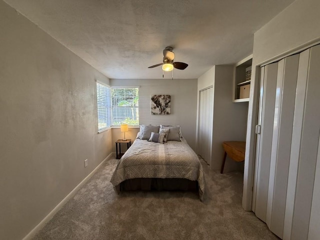 bedroom with ceiling fan and carpet flooring