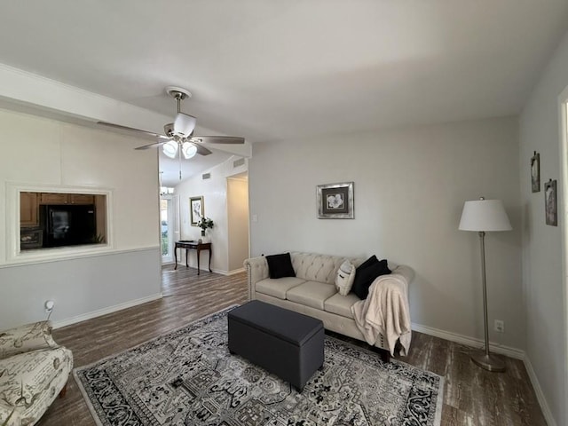 living room featuring lofted ceiling, ceiling fan, and dark hardwood / wood-style floors