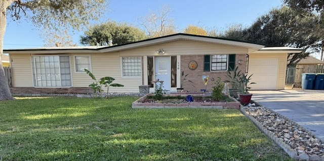 ranch-style home featuring a garage and a front lawn