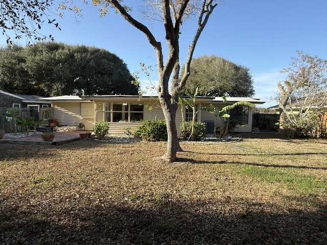 back of house with a yard