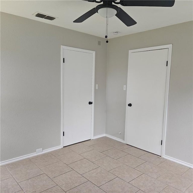 4749 Mokry Dr, Corpus Christi, TX 78415 - unfurnished room featuring ceiling fan, light tile patterned floors, baseboards, and a smoke detector