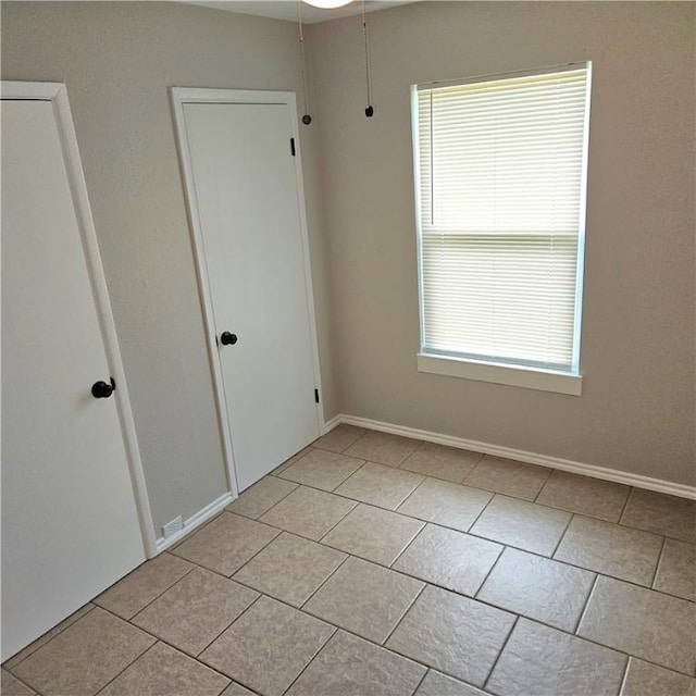 4749 Mokry Dr, Corpus Christi, TX 78415 - spare room featuring light tile patterned floors and plenty of natural light