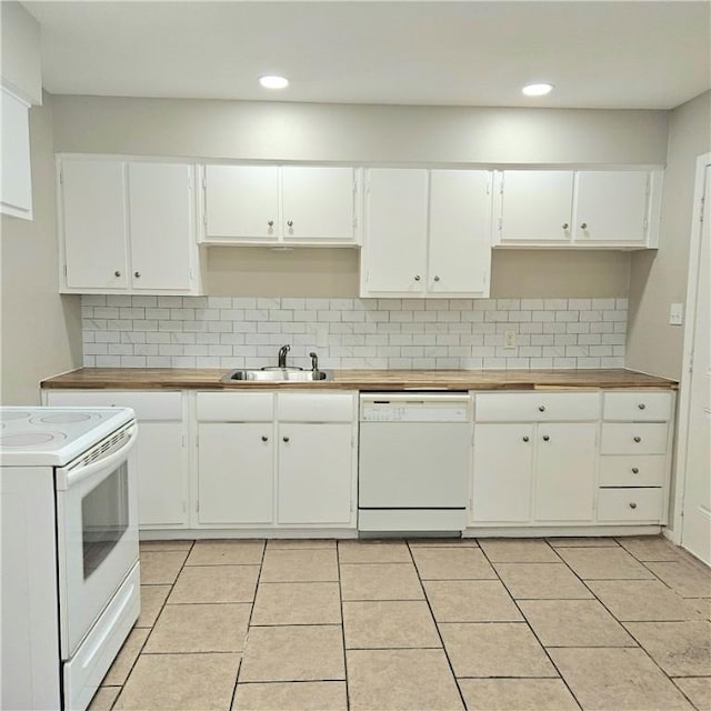 4749 Mokry Dr, Corpus Christi, TX 78415 - kitchen with white appliances, decorative backsplash, white cabinetry, light tile patterned flooring, and recessed lighting