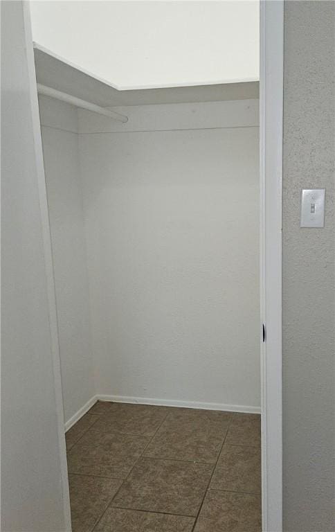 4749 Mokry Dr, Corpus Christi, TX 78415 - spacious closet featuring dark tile patterned flooring