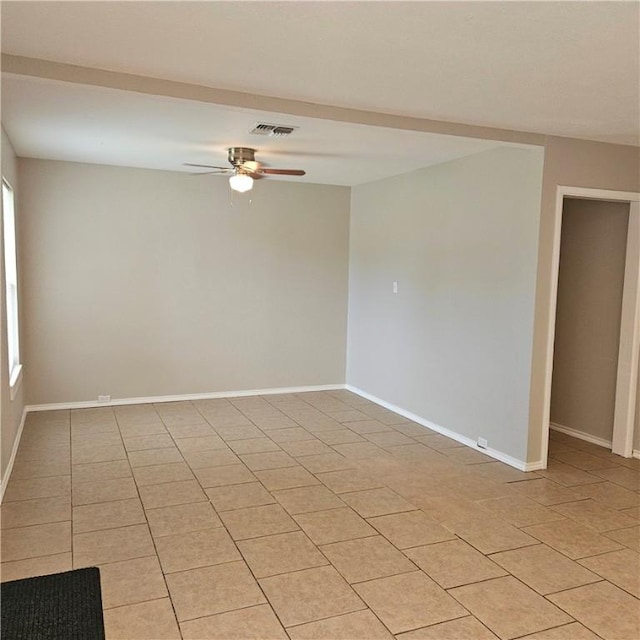 4749 Mokry Dr, Corpus Christi, TX 78415 - empty room featuring ceiling fan, light tile patterned floors, and plenty of natural light