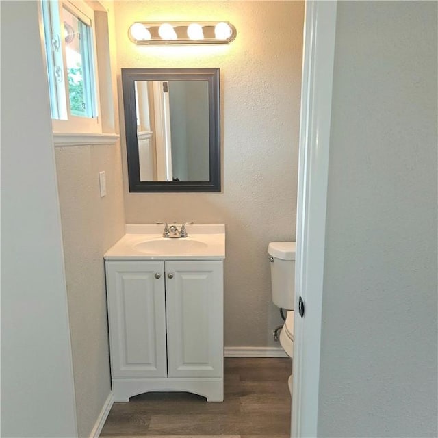 4749 Mokry Dr, Corpus Christi, TX 78415 - half bathroom featuring vanity and wood finished floors