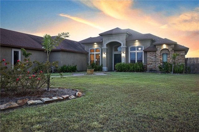 view of front of house with a lawn