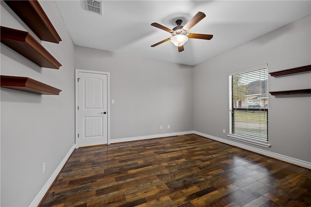 unfurnished room featuring ceiling fan and dark hardwood / wood-style flooring