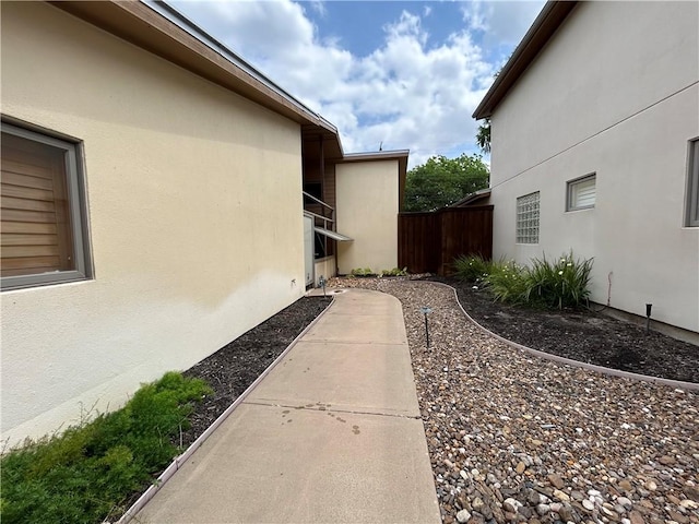 1504 Morningside Dr, Alice, TX 78332 - view of home's exterior featuring stucco siding and fence