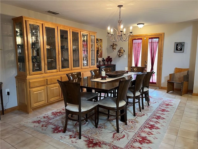 1504 Morningside Dr, Alice, TX 78332 - dining space with light tile patterned floors and a chandelier