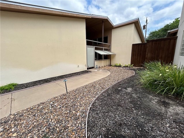 1504 Morningside Dr, Alice, TX 78332 - view of property exterior featuring stucco siding and fence