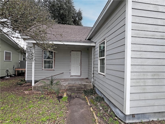 view of exterior entry featuring central AC