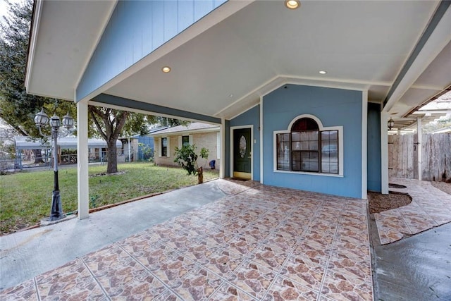 exterior space featuring a patio area and a front lawn