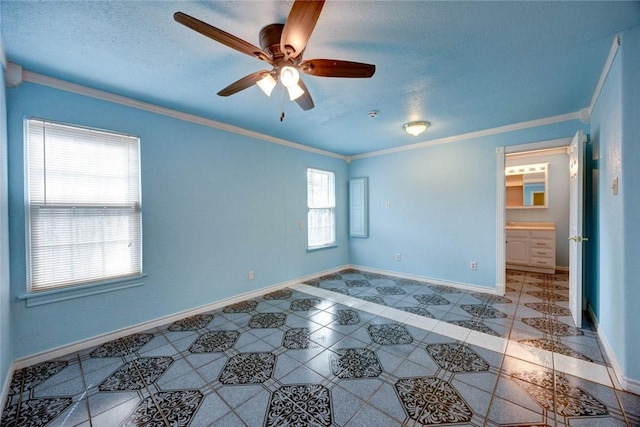 unfurnished room with ceiling fan and crown molding