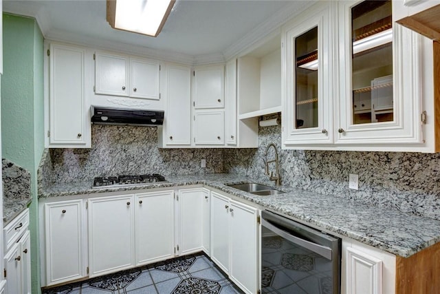 kitchen featuring stainless steel gas stovetop, light stone countertops, dishwasher, white cabinetry, and sink